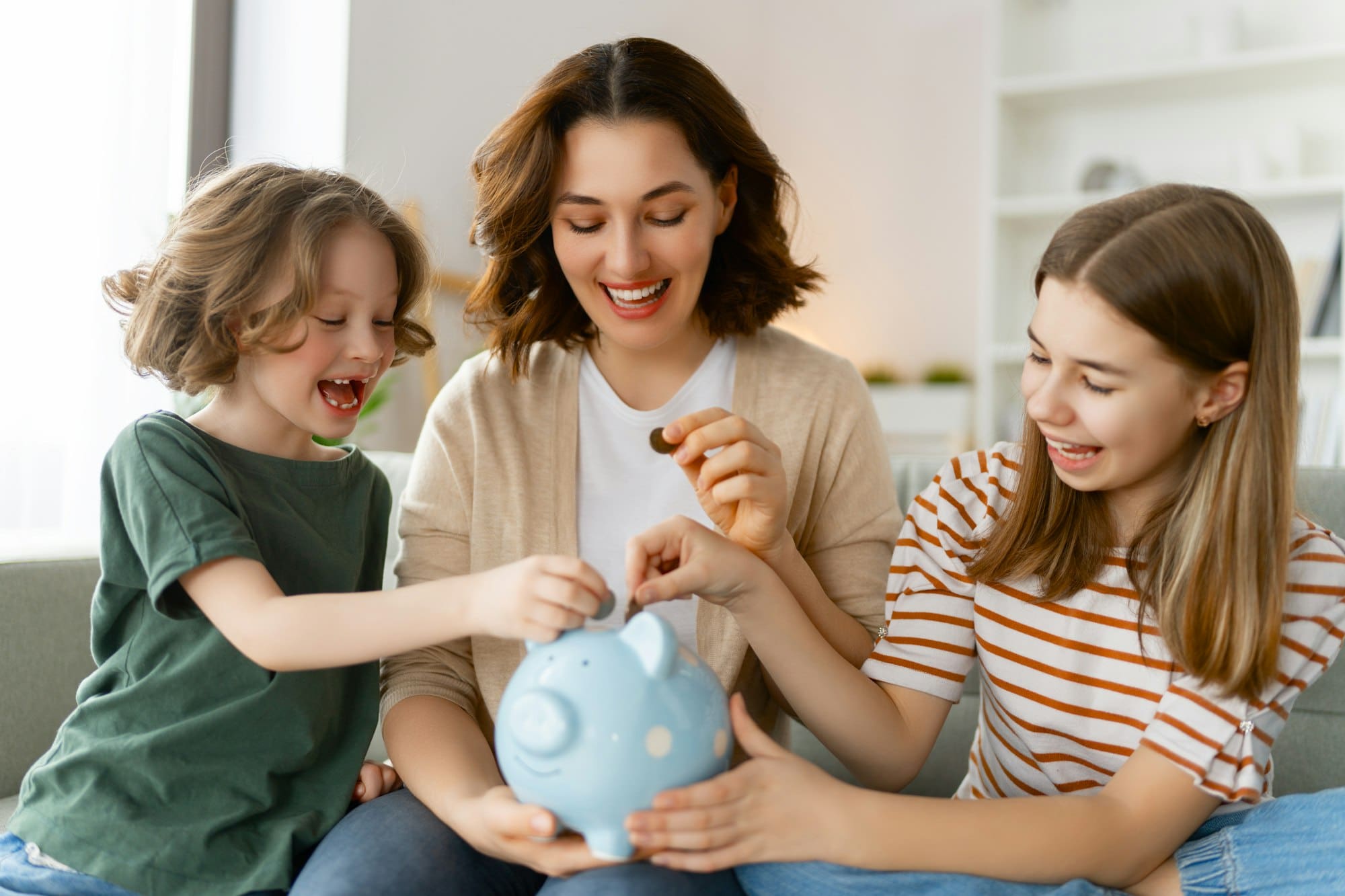 Woman and children with a piggy bank